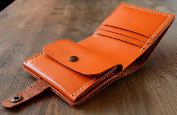 Hand-stitched cognac leather wallet, detail view